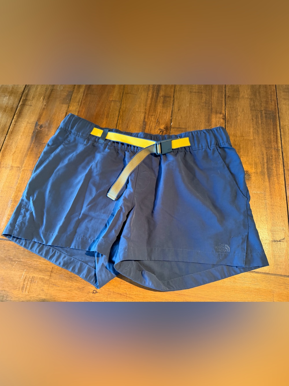 The North Face Navy Blue Men’s Jogger Shorts with Yellow Webbing Belt